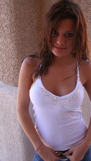 18 tear old schoolgirl Tiff Bannister takes selfies while disrobing in bedroom